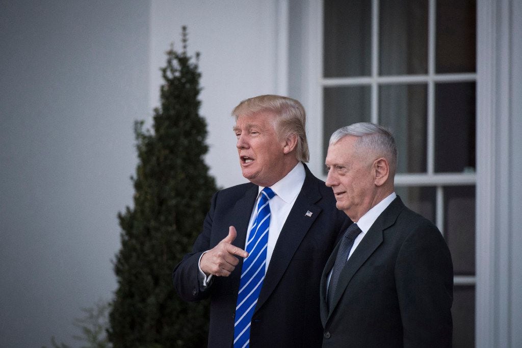 President-elect Donald Trump walks out with retired Marine Corps Gen. James Mattis after a...