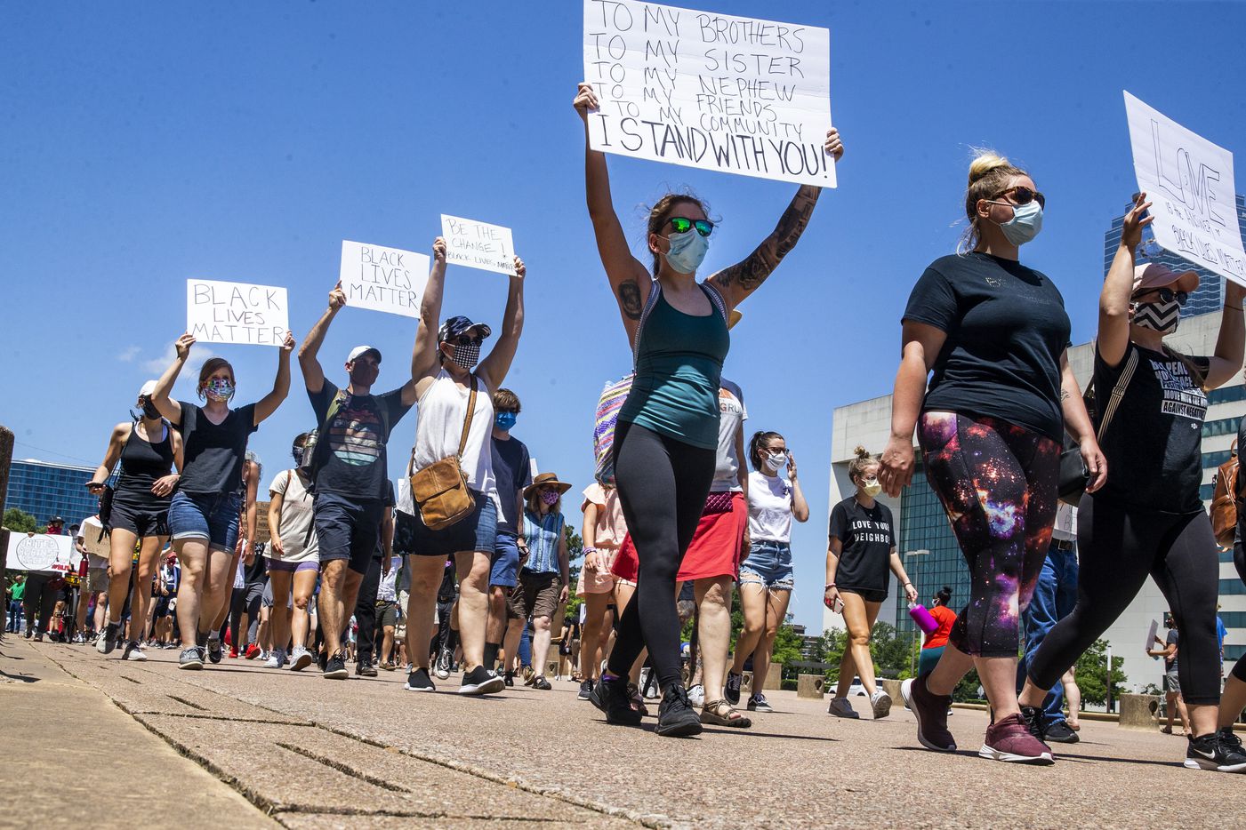 Protesters march in a silent demonstration at Dallas City Hall to denounce police brutality and systemic racism in Dallas on Thursday, June 4, 2020. The demonstration took place on the seventh day of organized protests in response to the recent deaths of George Floyd in Minneapolis and Breonna Taylor in Louisville.