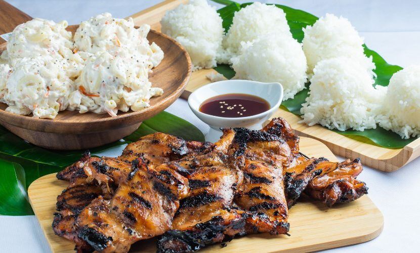 Mo' Bettahs' ʻOhana Meal which includes the customer's choice of chicken or kālua pig, rice...