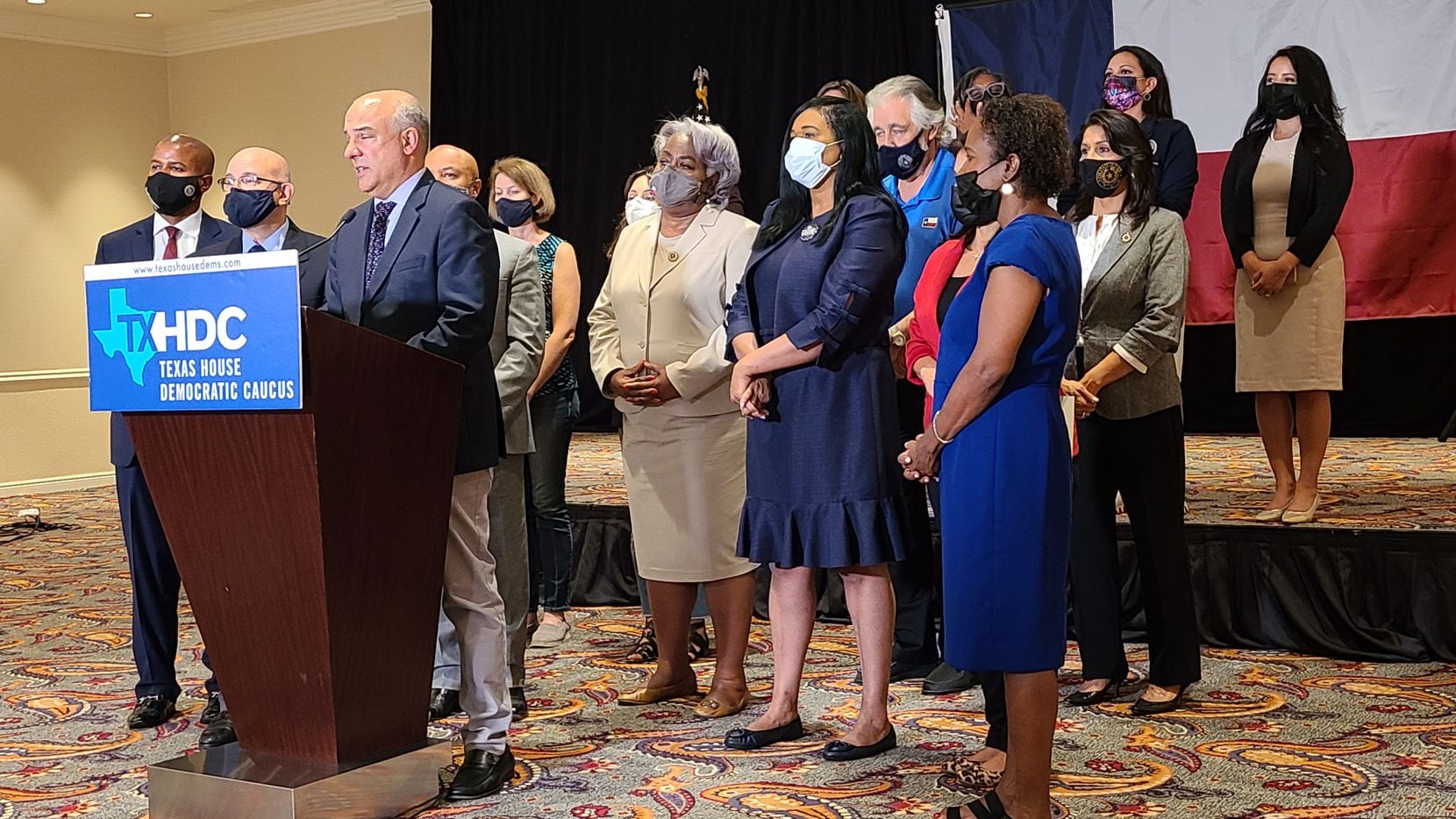 State Rep. Chris Turner of Grand Prairie, chair of the Texas House Democratic Caucus, with 18 colleagues, speaks with news media July 20, 2021, at the Washington Plaza hotel near the White House on day nine of their quorum break over voting rights.