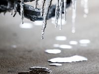Small icicles melt off the front of a car in Dallas on Wednesday, Feb. 1, 2023. A half inch...