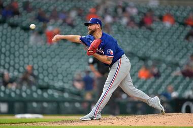 Texas Rangers pitcher Kirby Yates throws against the Detroit Tigers in the ninth inning of a...