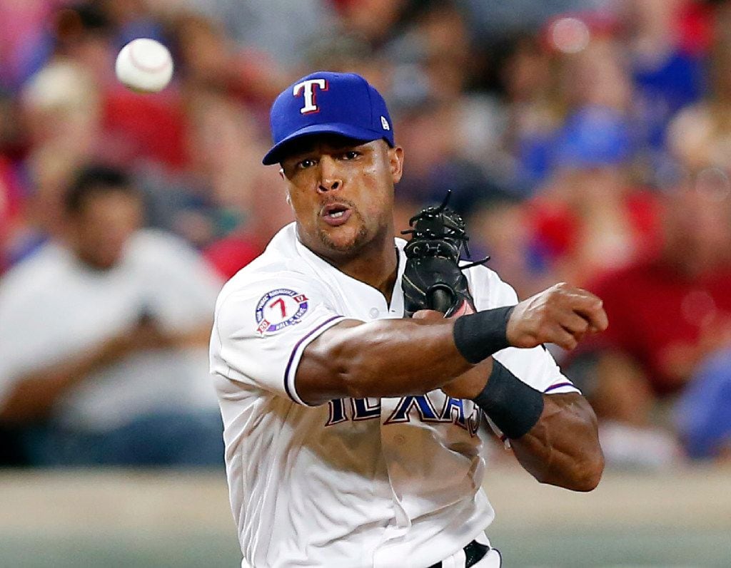 Texas Rangers third baseman Adrian Beltre (29) throws out Baltimore Orioles batter Trey...