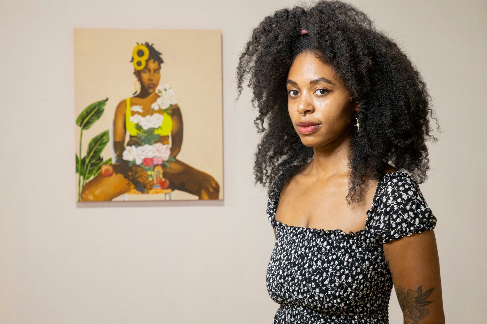 Artist Ari Brielle poses for a photo with her piece 'Altar' which is part of 500x Gallery's 'Vivrant Thang' exhibit curated by Ciara Elle Bryant on Aug. 14, 2020 in Dallas. 