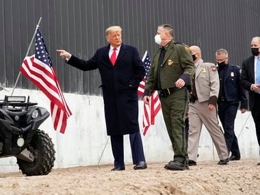 President Donald Trump tours a section of the U.S.-Mexico border wall under construction Tuesday, Jan. 12, 2021, near Alamo, Texas.