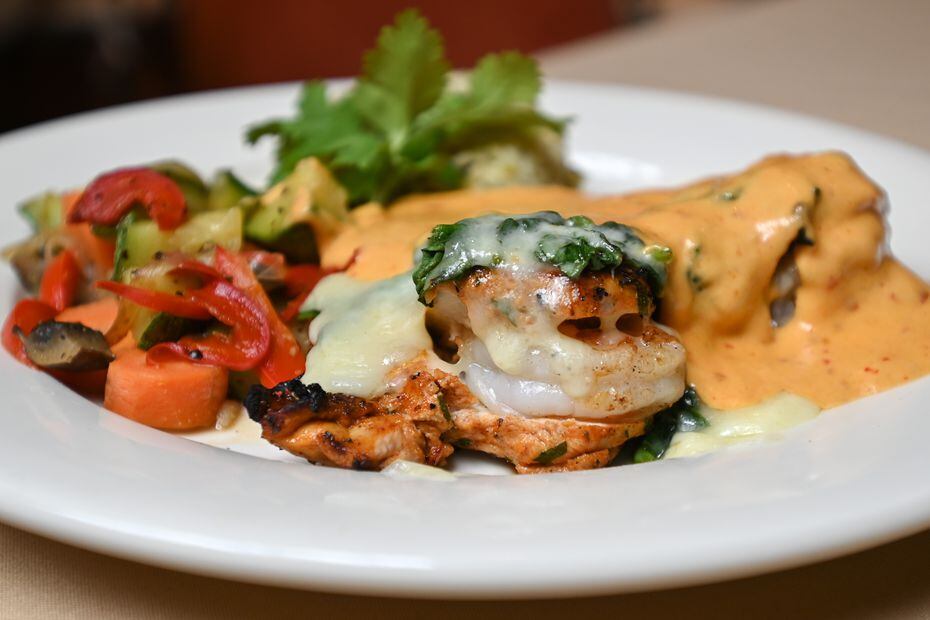 Casa Rosa's pollo chipotle is grilled chicken and shrimp topped with chipotle cream sauce.