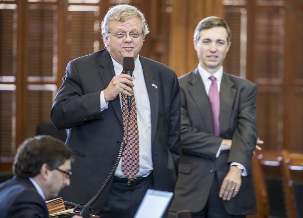 Sen. Paul Bettencourt debates tax cuts with Sen. Kirk Watson on the senate floor in Austin....