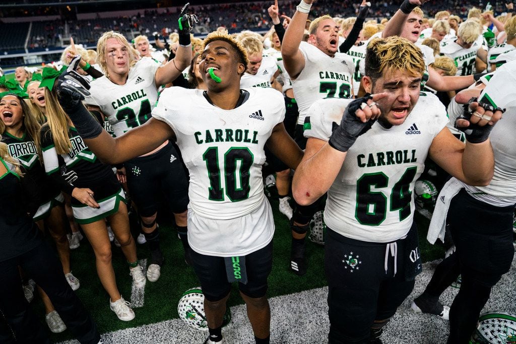 Southlake Carroll football players and cheerleaders celebrate after a 37-15 win over DeSoto...