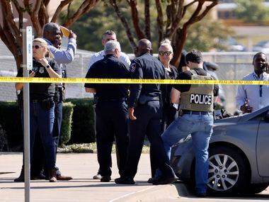 Police officials work the scene of a school shooting at Mansfield Timberview High School in...