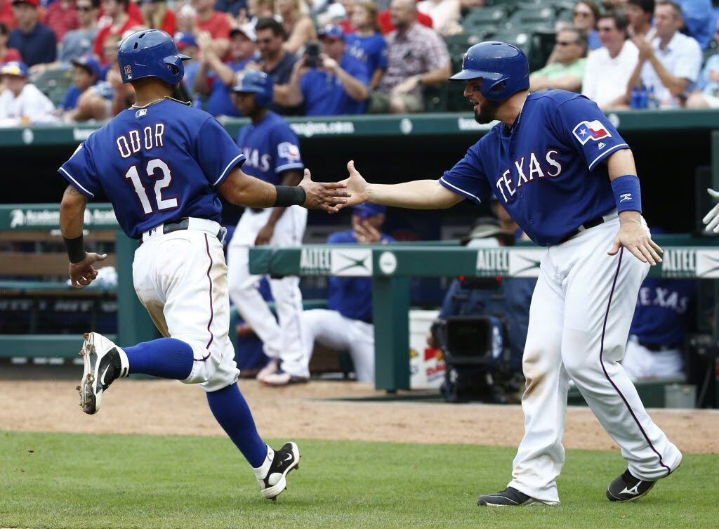 Texas Rangers second baseman Rougned Odor (12) is congratulated after being hit in against ...