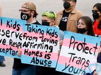 Protesters advocating the state's policy of investigating parents who allow their kids to...