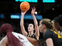 Iowa guard Caitlin Clark (22) scores her 41st point of the game with a free throw in the...