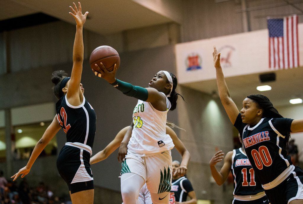 DeSoto's Michayla Gatewood goes up for a shot against Duncanville in a Class 6A Region I...