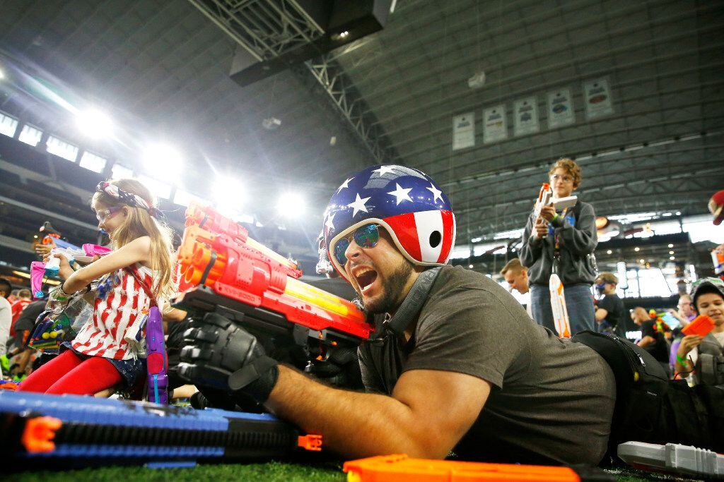 Oscar Marroquin, fires a Nerf gun during Jared's Epic Nerf Battle 2 at AT&T Stadium in...
