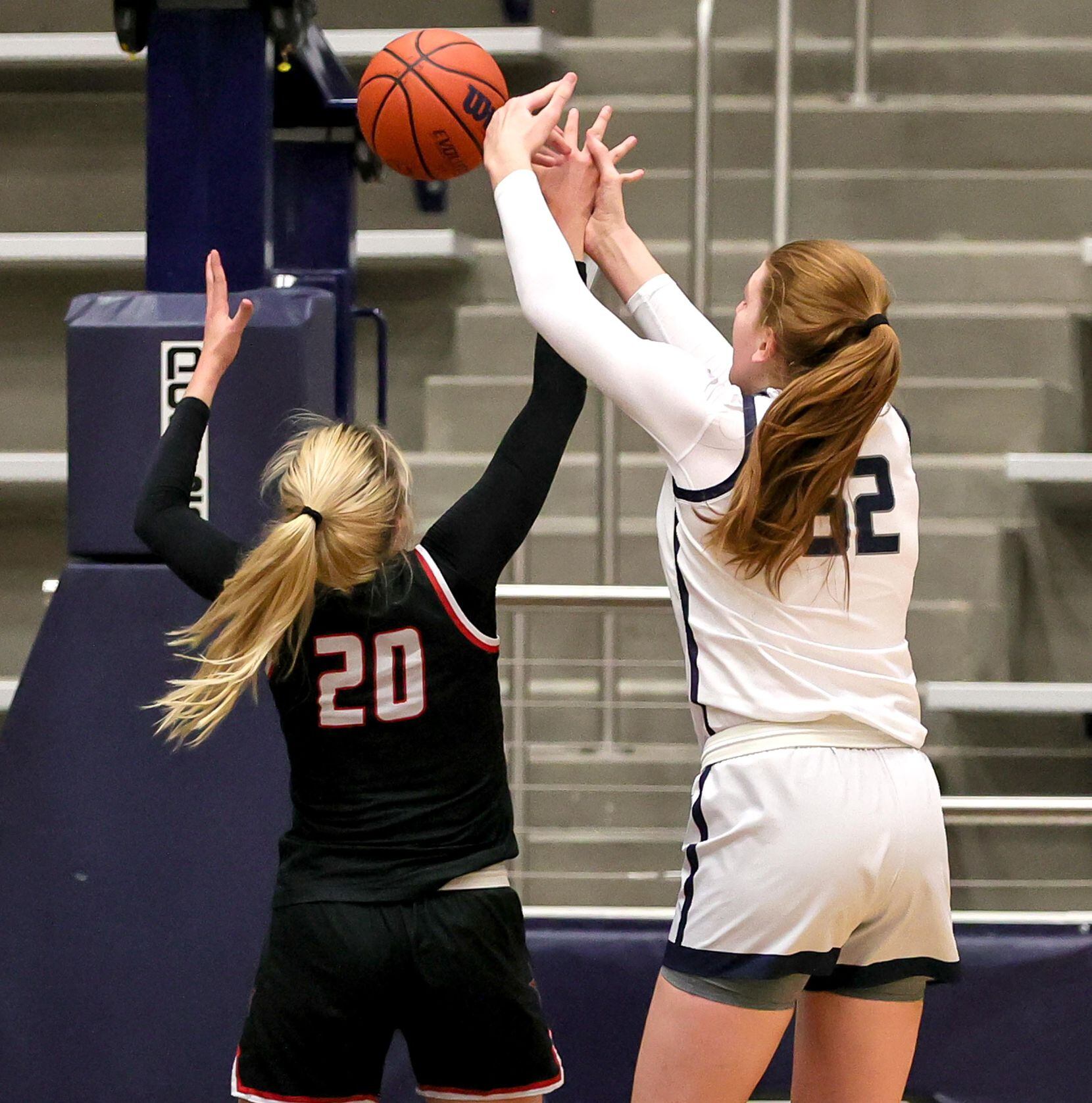 Flower Mound center Abbie Boutilier (52) and Coppell guard Julianna Lamendola (20) go for a...