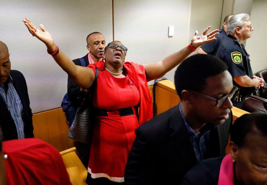 Botham Jean's mother, Allison Jean, rejoices in the courtroom after fired Dallas police Officer Amber Guyger was found guilty of murder by a 12-person jury in the 204th District Court at the Frank Crowley Courts Building in Dallas on Oct. 1.. Guyger shot and killed Botham Jean, an unarmed 26-year-old neighbor in his own apartment last year. She told police she thought his apartment was her own and that he was an intruder. (Tom Fox/The Dallas Morning News/Pool)