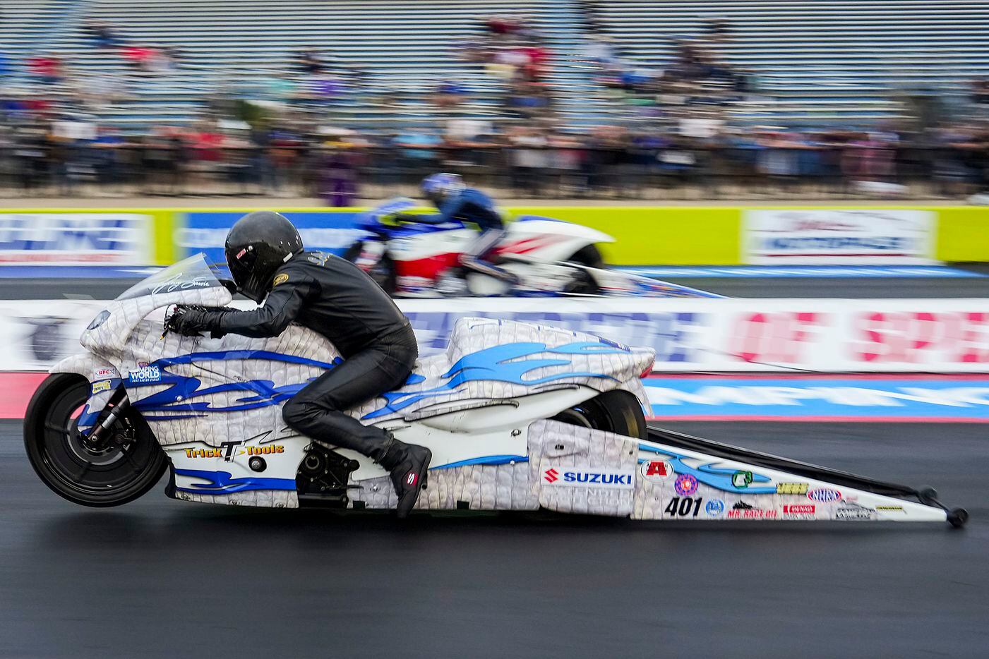 Jerry Savoie (front) and Hector Arana, Jr., race in the Pro Stock Motorcycle finals, won by...