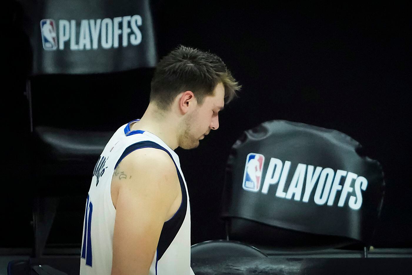 Dallas Mavericks guard Luka Doncic walks off the court after a loss to the LA Clippers in...