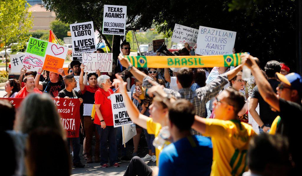 Protesters and supporters of Brazil's controversial president, Jair Bolsonaro, lined the...