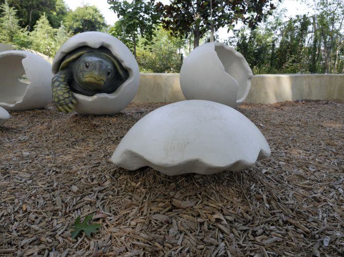 The statue of a turtle coming out of it's shell is one of the sights toddles will see when...