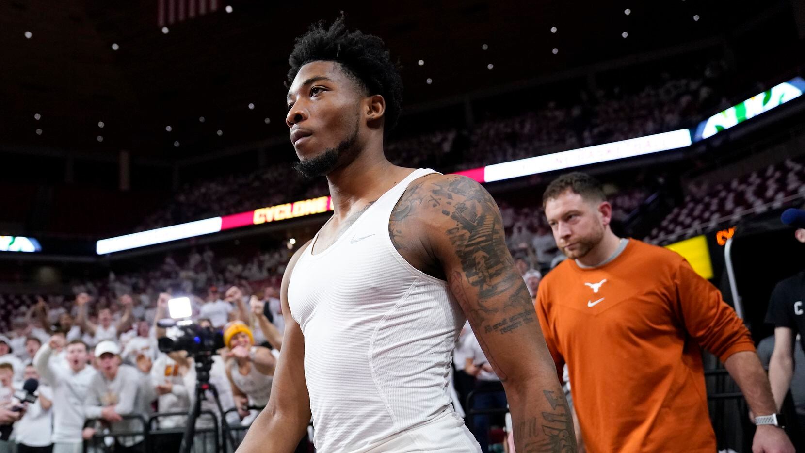 Texas guard Tyrese Hunter walks onto the court before an NCAA college basketball game...