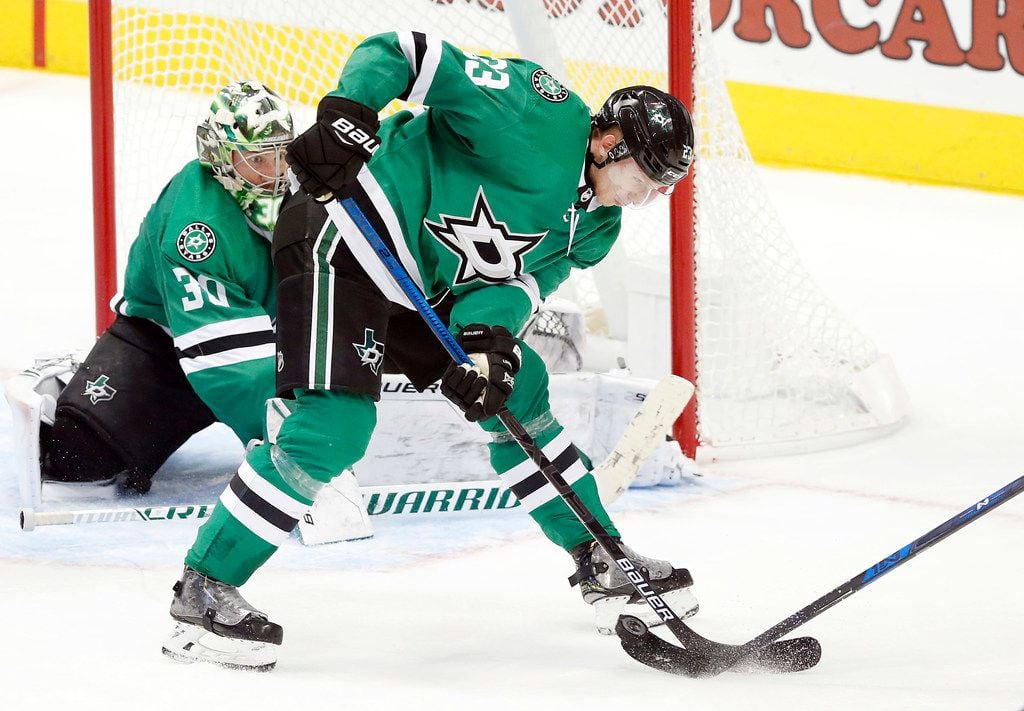 Dallas Stars defenseman Esa Lindell (23) stops a shot on goal by the Los Angeles Kings...