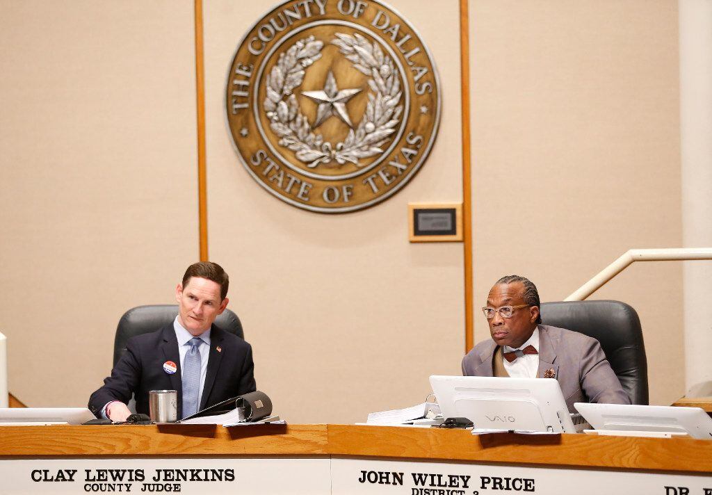 County Judge Clay Jenkins (left) and District 3 Commissioner John Wiley Price listen during...