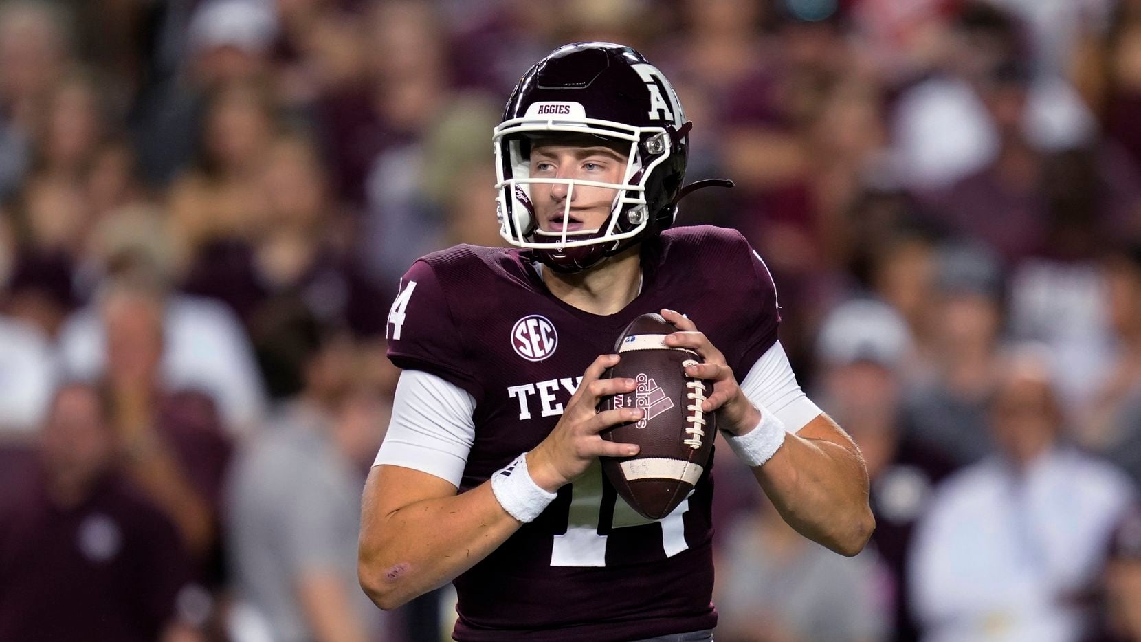 Texas A&M quarterback Max Johnson looks for a receiver during the first quarter of the...