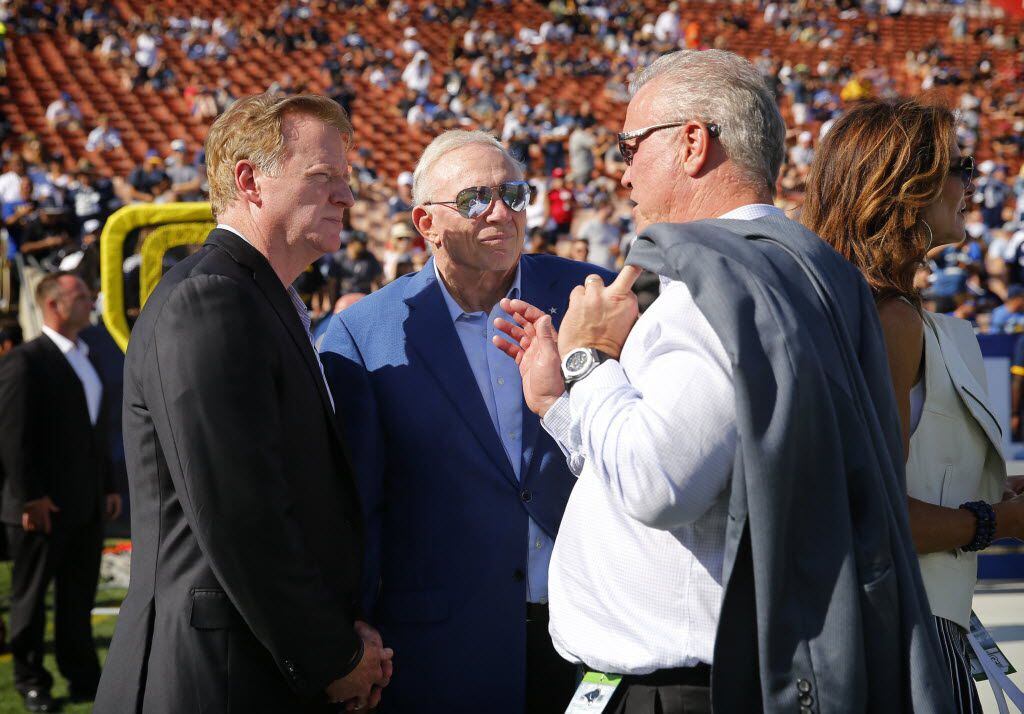 NFL Commissioner Roger Goodell (left) visits with Dallas Cowboys owner Jerry Jones (center)...
