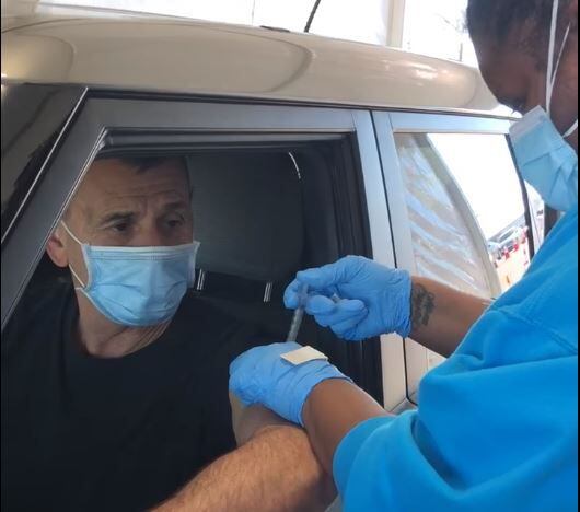 DeSoto Police Chief Joe Costa gets a COVID-19 vaccine as part of an effort to encourage...