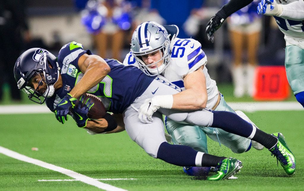 FILE - Dallas Cowboys outside linebacker Leighton Vander Esch (55) tackles Seattle Seahawks...