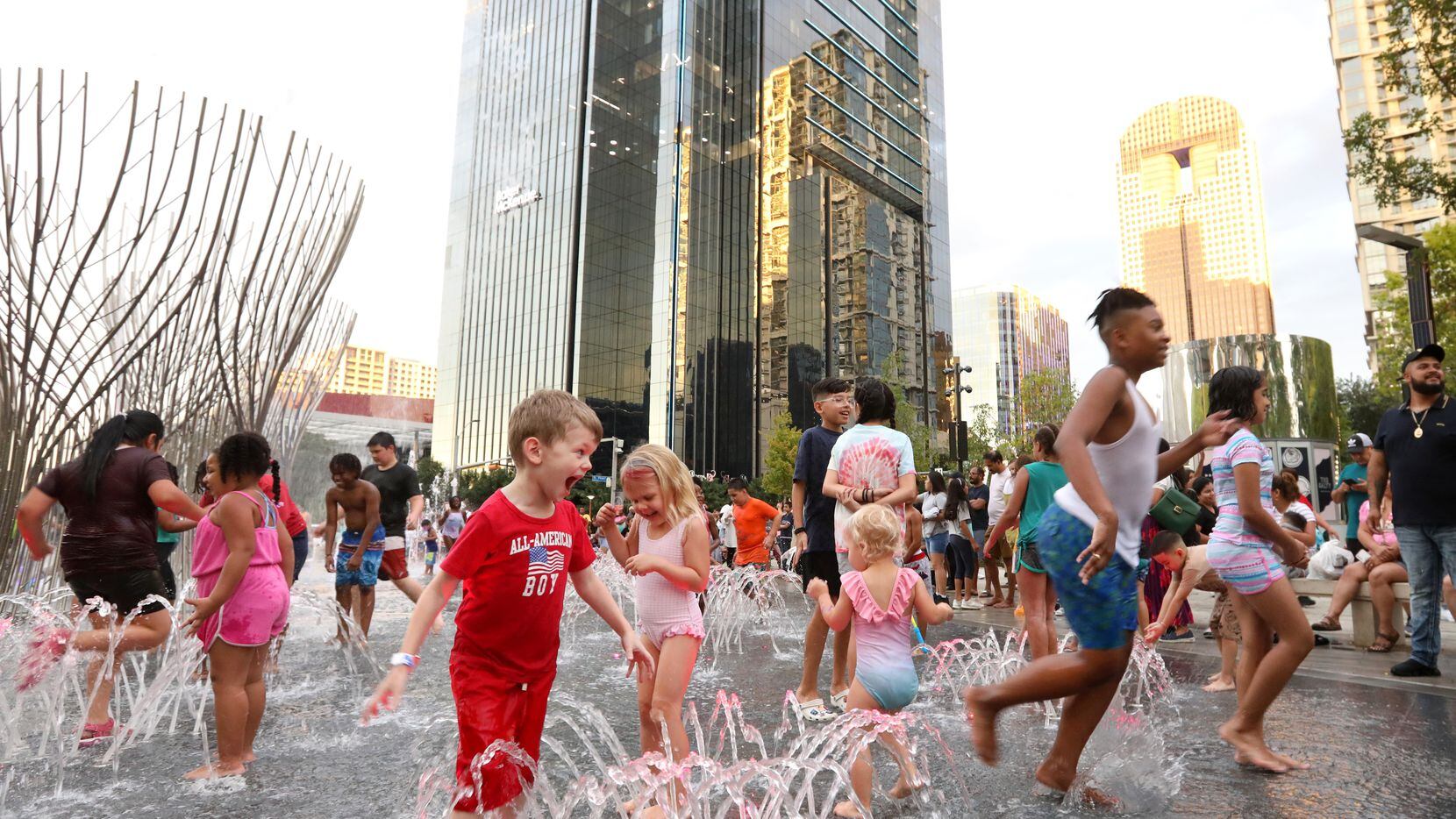The Nancy Best Fountain in Klyde Warren Park is a splash pad by day, and it adds a colorful...