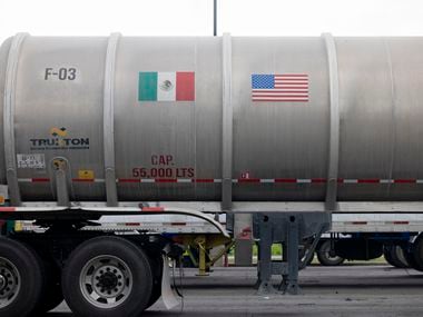 A trailer with Mexican and U.S. flag decals sits at a rest stop near the recently reopened...