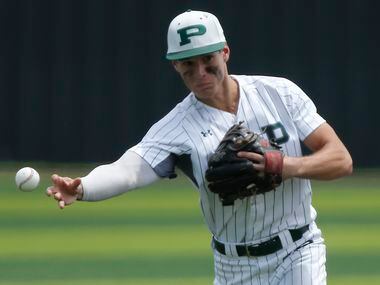 Prosper shortstop Chase Pendley (1) makes a throw to first base in the fourth inning as...
