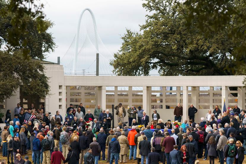 A crowd gathers at Dealey Plaza on Nov. 22, 2019, in Dallas. 2023 marks the 60th anniversary...