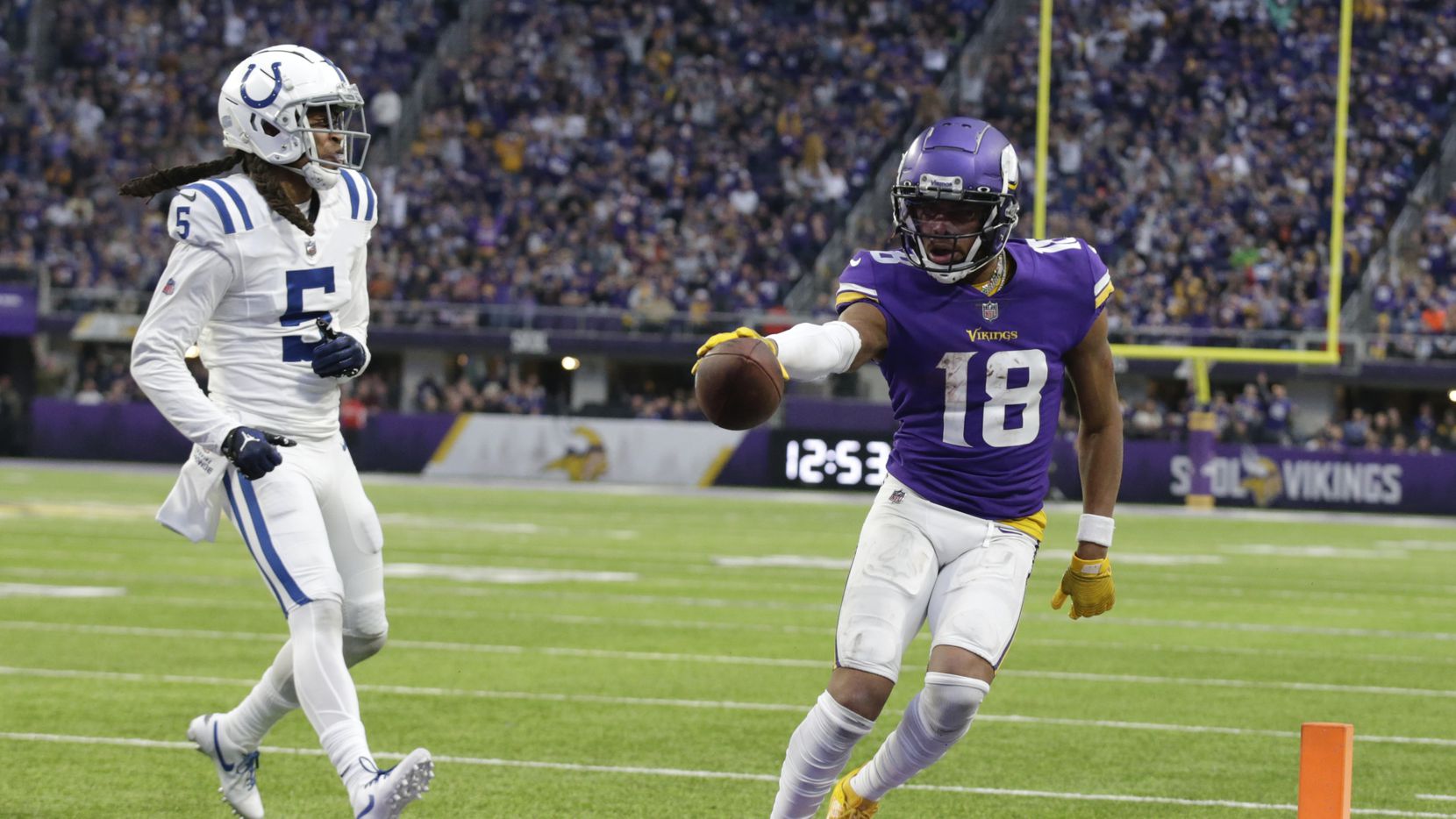 Minnesota Vikings wide receiver Justin Jefferson (18) catches an 8-yard touchdown pass ahead...