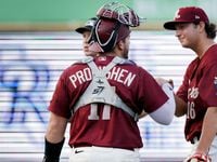 Texas Rangers prospect Owen White (right) is greeted by catcher Jordan Procyshen (17) after...