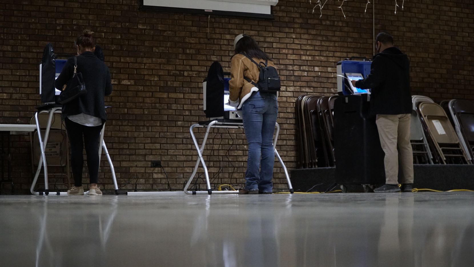 Voters cast their ballots at the Knights of Columbus building on the north side of Fort...