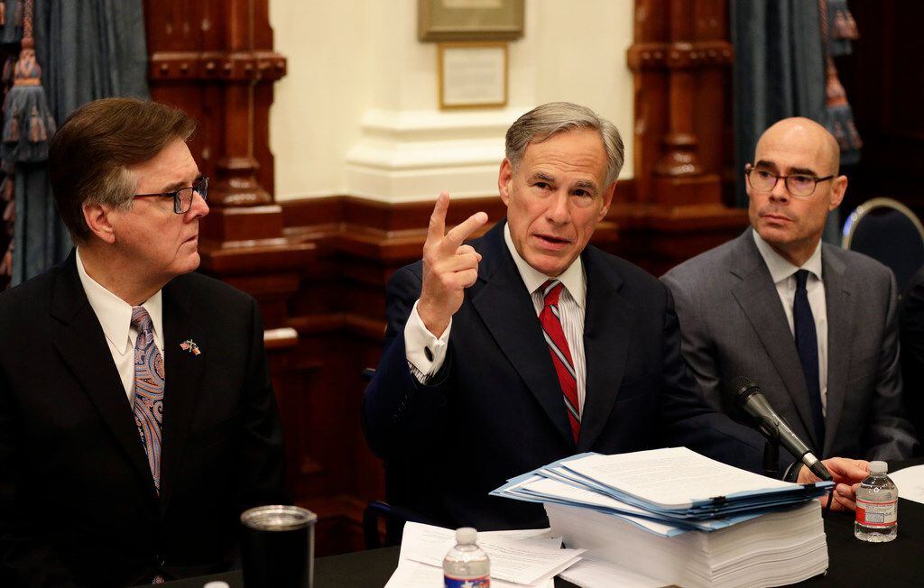Texas Gov. Greg Abbott (center), with Speaker of the House Dennis Bonnen (right) and Lt....