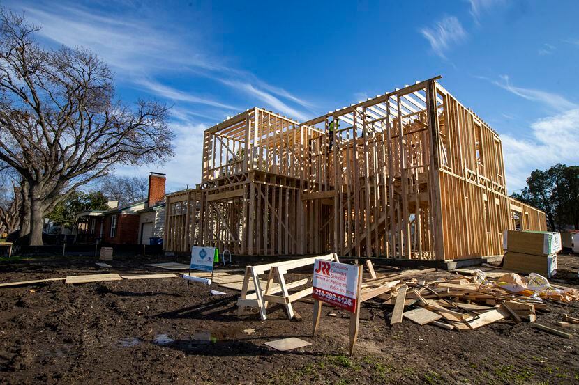 Workers constructed a two-story house in the Elm Thicket-Northpark neighborhood in North...