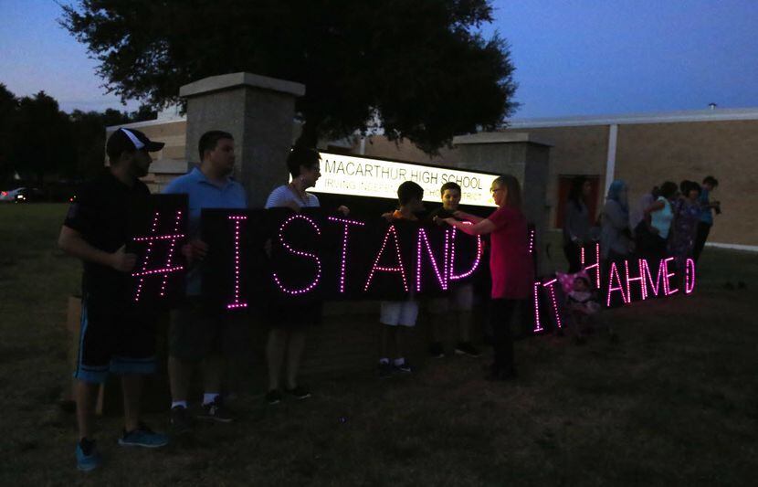 Ahmed Mohamed supporters hold #IStandWithAhmed L.E.D. signs at a rally at MacArthur High...