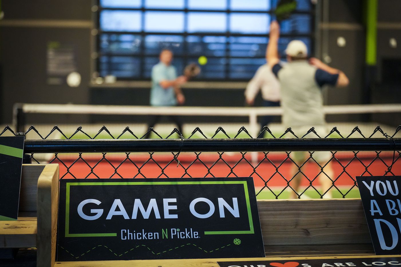 Patrons play pickleball at Chicken N Pickle on Friday, Dec. 9, 2022, in Grand Prairie.