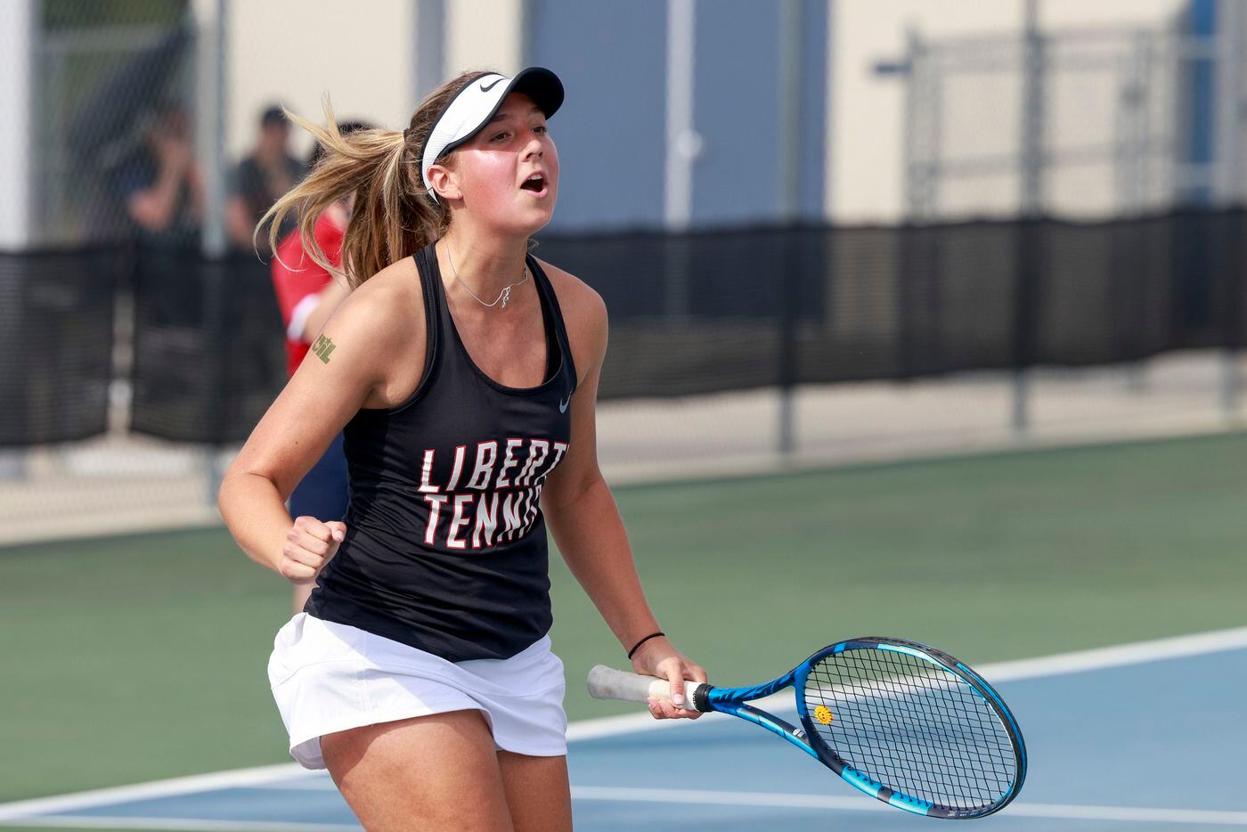 Frisco Liberty’s s Milla Dopson celebrates a point during the 5A mixed doubles championship...