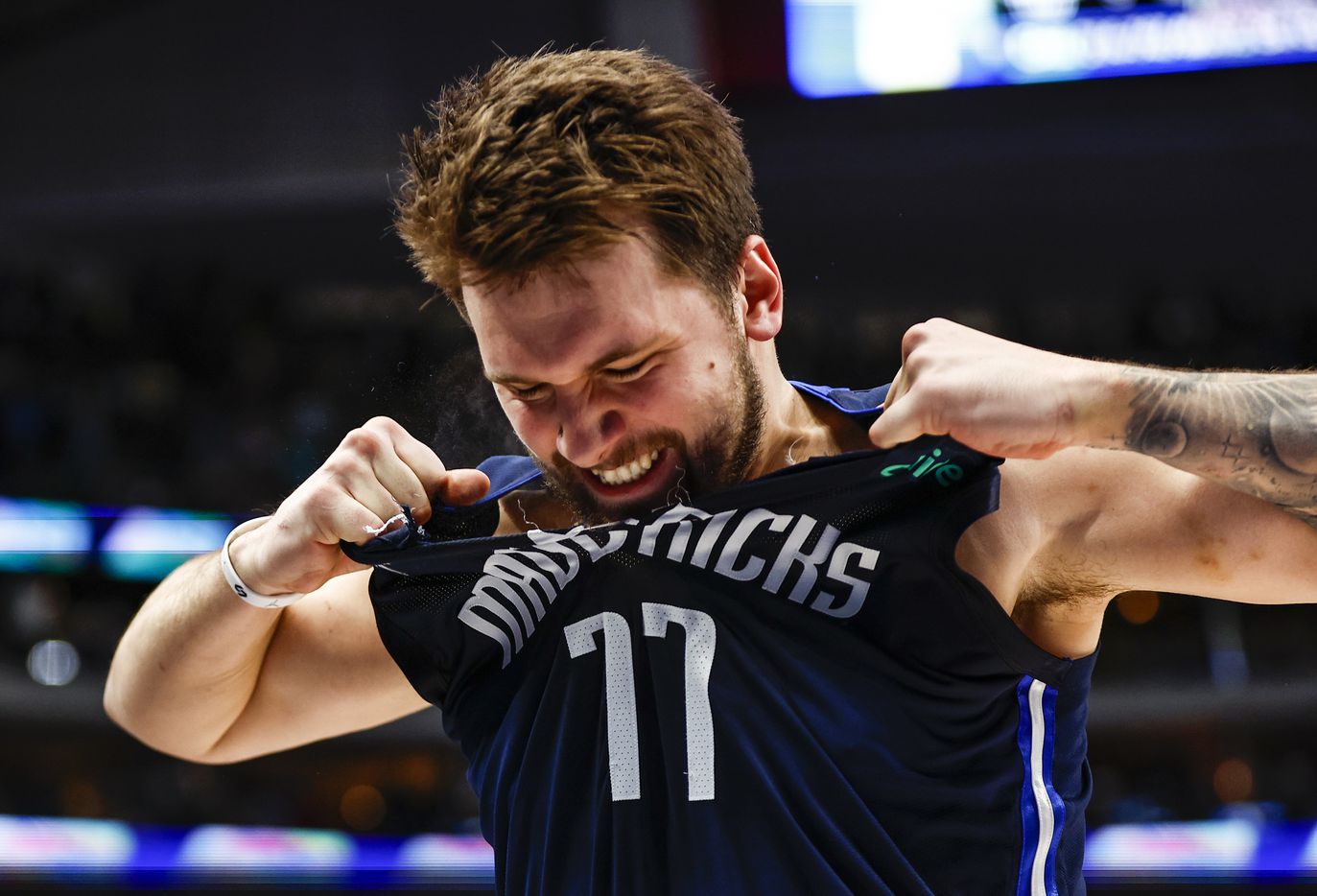 Dallas Mavericks guard Luka Doncic (77) rips his jersey in frustration after missing the game winning shot  after an NBA basketball game against the LA Clippers in Dallas, Saturday, February 12, 2022. LA won 99-97. 