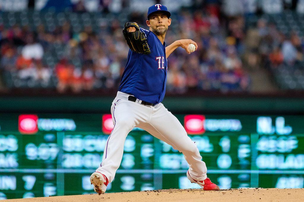 Texas Rangers pitcher Mike Minor throws during the first inning against the Houston Astros...