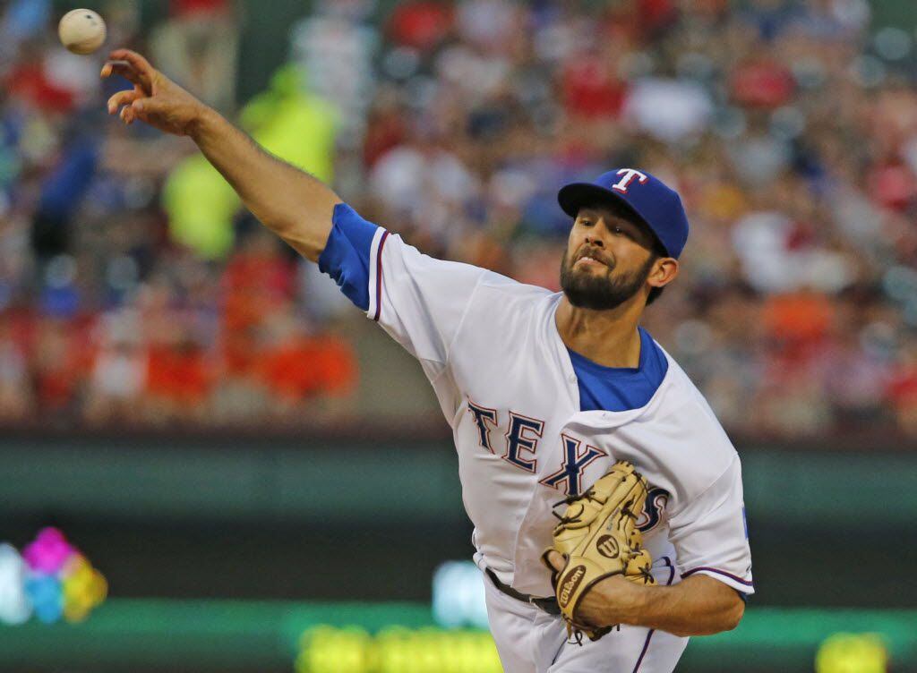 Texas Rangers starting pitcher Nick Martinez (22) throws a third-inning pitch during the...