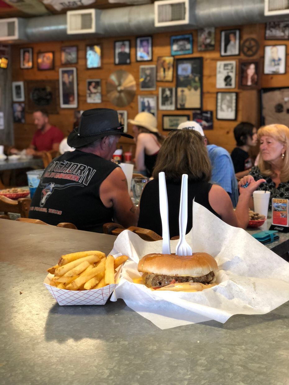 Grumps' Queso Burger requires knife and fork, but only to cut it in half. Then you just go all in: two hands, big bites, napkins needed.