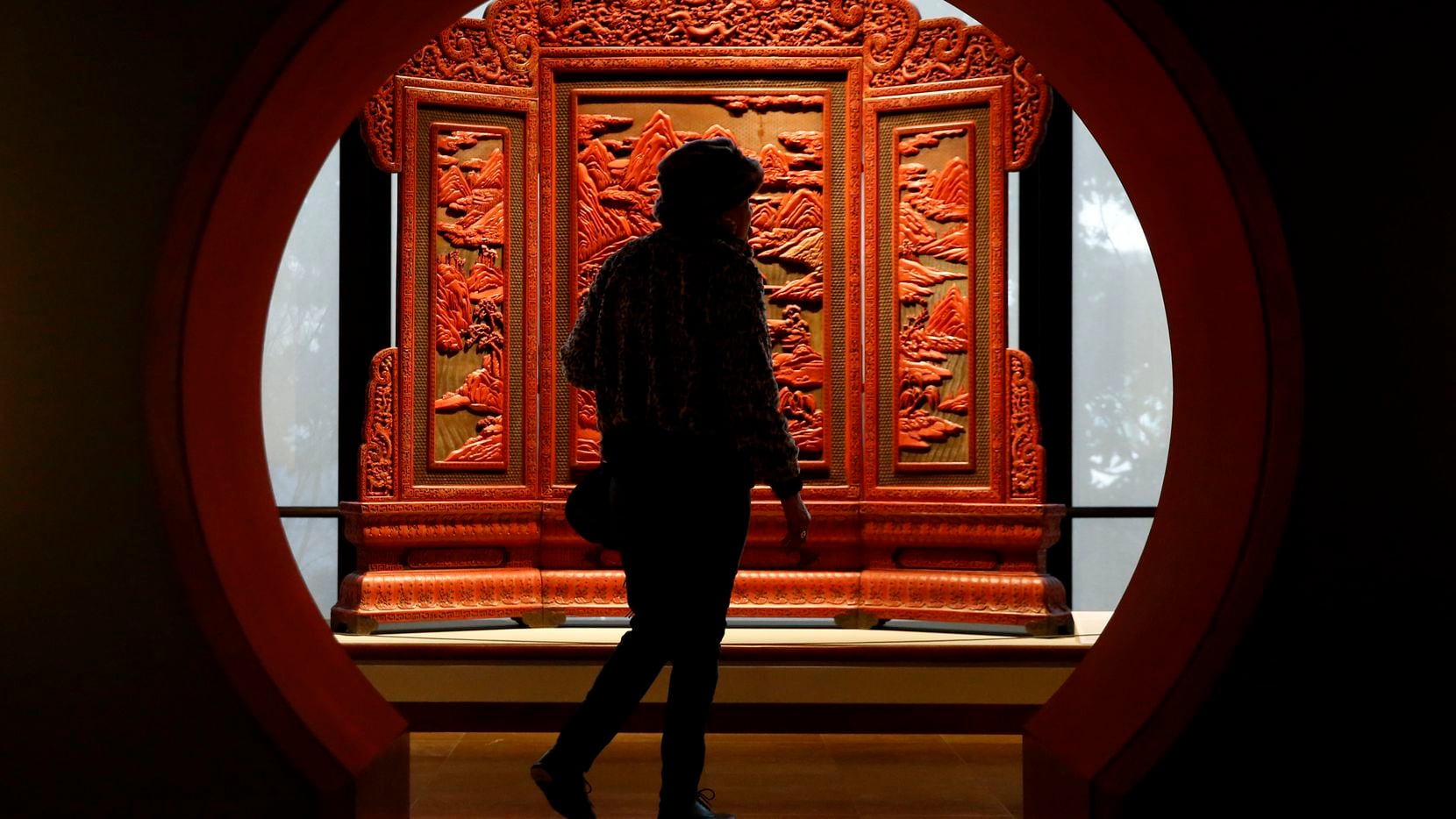 Florence Barnett walks past a lacquered screen at the Crow Museum of Asian Art in Dallas on...