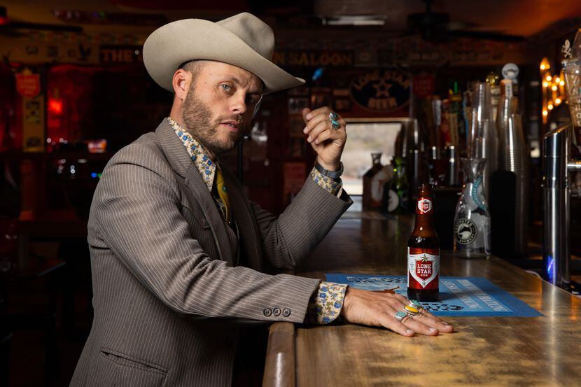 Charley Crockett poses Tuesday at the bar of the Little Longhorn Saloon in Austin, where he...
