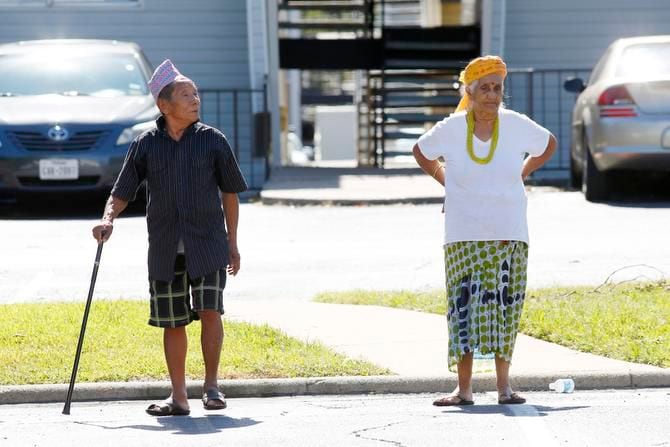 
Two residents walk to their apartment after celebrating a Hindu festival in Dallas’ Vickery...